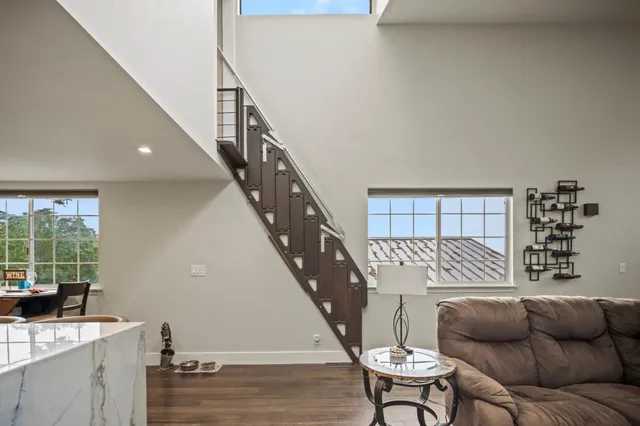 a view of cars parked on the side of a street