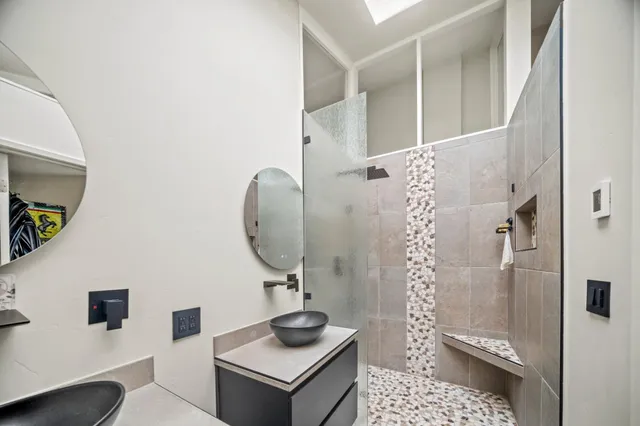 a view of a deck with couches wooden floor and fence