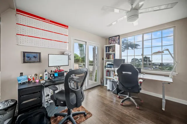 a bedroom with a bed and flat screen tv