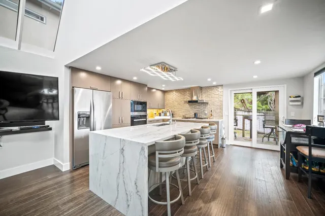 a dining room with furniture and wooden floor