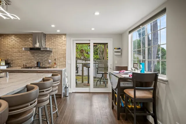 a kitchen with granite countertop a stove oven and sink
