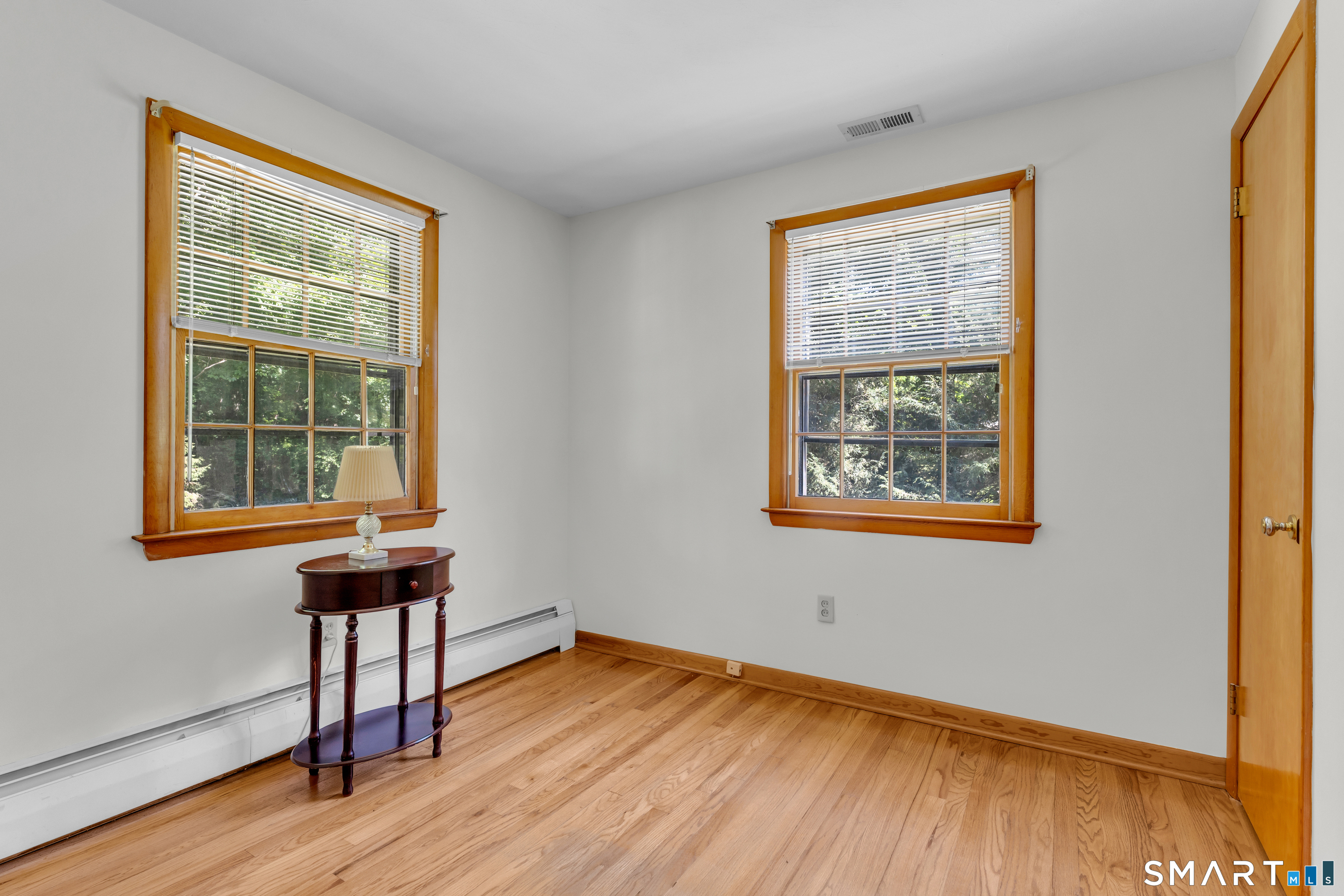 25 Goose Hill Road Chester, CT 06412 - Photo 12 of 24 Second bedroom with hardwood floors. If desired, this room also has expansion potential to the side or back of property.