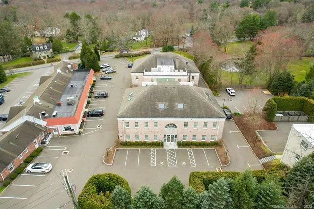 an aerial view of a house with yard swimming pool and outdoor seating