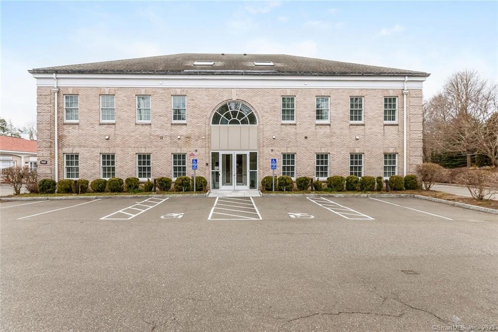 1990 Bronson Road, Unit 2 Fairfield, CT 06824 - Photo 14 of 33 front view of a building with a street