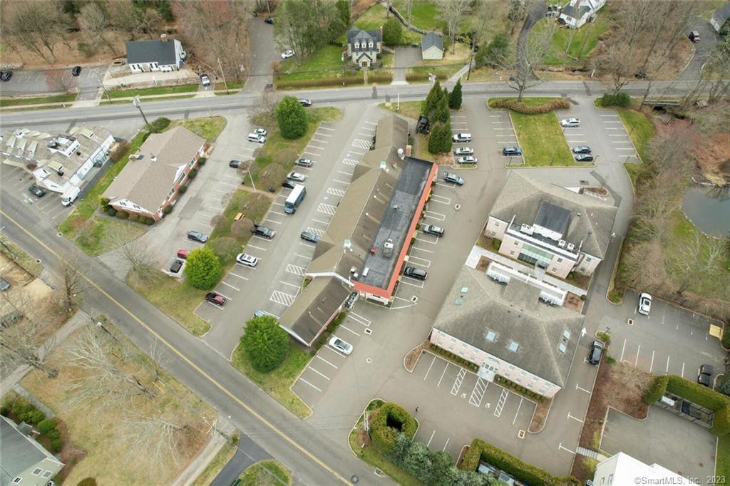 1990 Bronson Road, Unit 2 Fairfield, CT 06824 - Photo 18 of 33 an aerial view of residential houses with outdoor space
