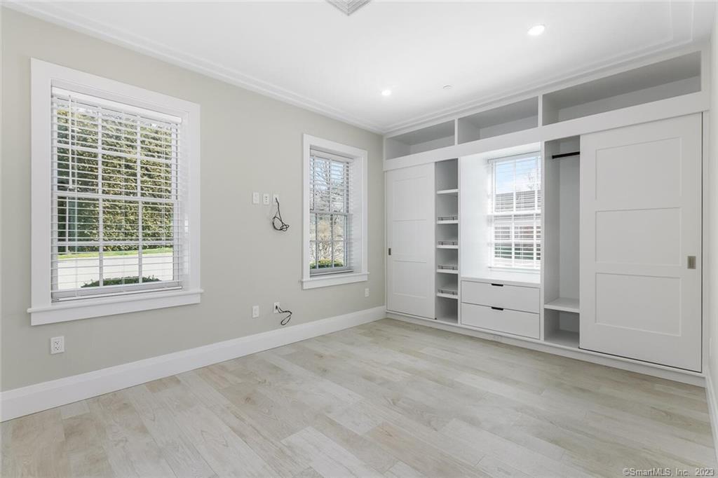 1990 Bronson Road, Unit 2 Fairfield, CT 06824 - Photo 2 of 33 an empty room with windows