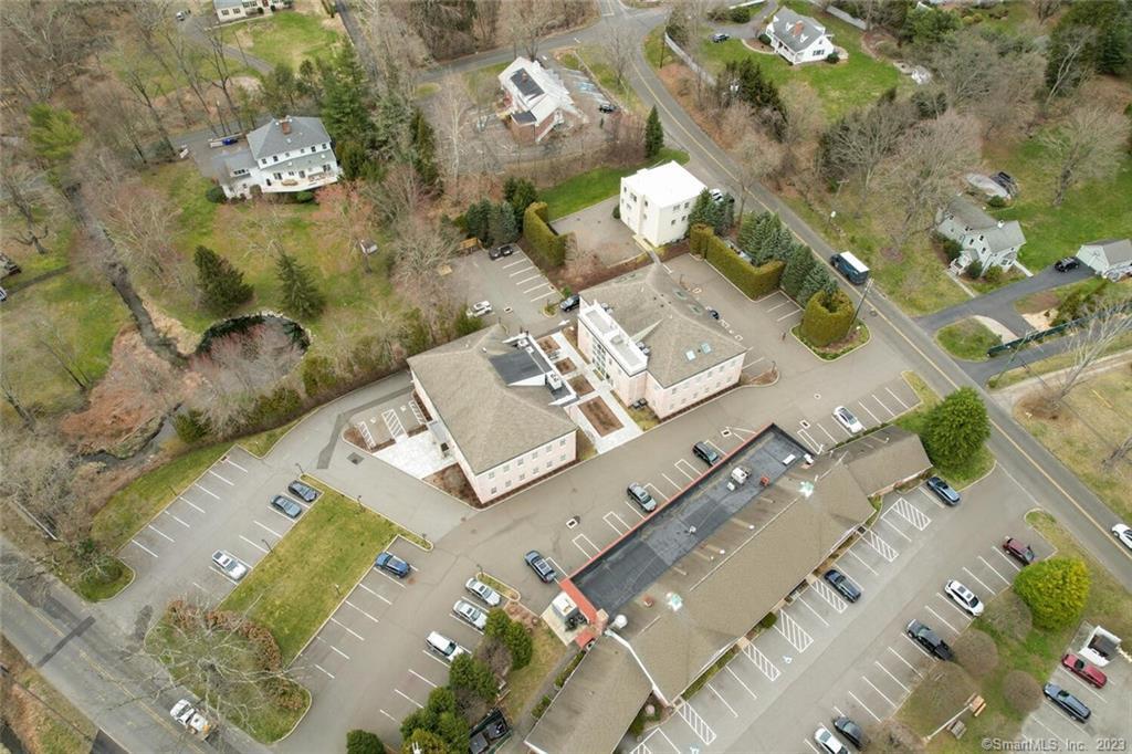 1990 Bronson Road, Unit 2 Fairfield, CT 06824 - Photo 25 of 33 an aerial view of residential houses with outdoor space