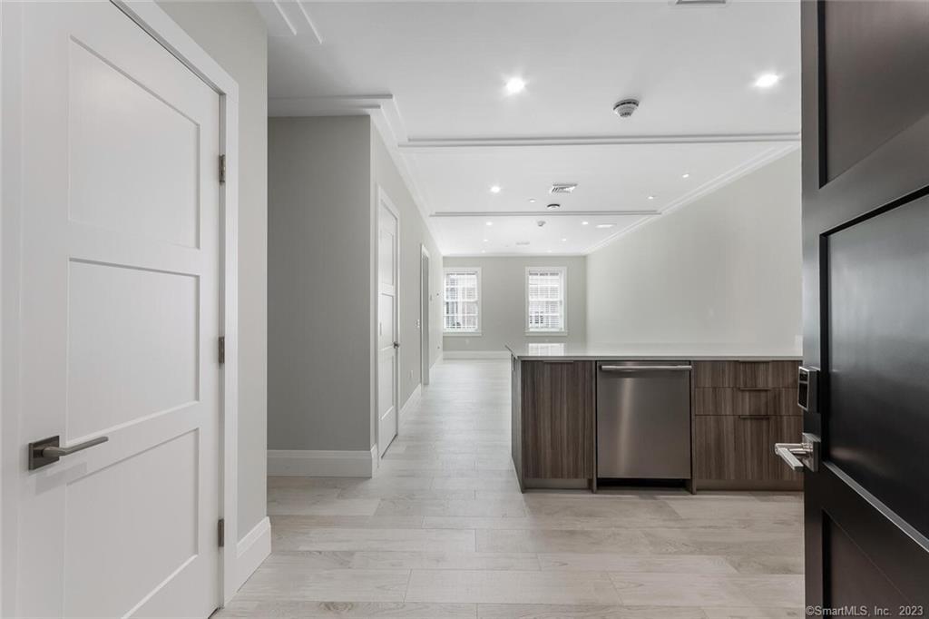 1990 Bronson Road, Unit 2 Fairfield, CT 06824 - Photo 3 of 33 a view of an empty room and window