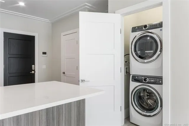 a bedroom with a washer and dryer