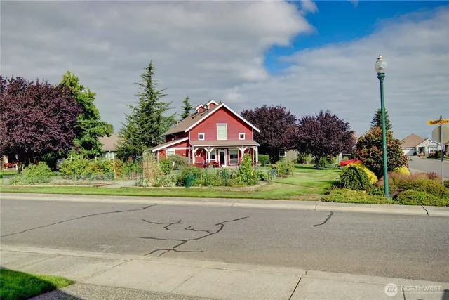 a front view of a house with yard
