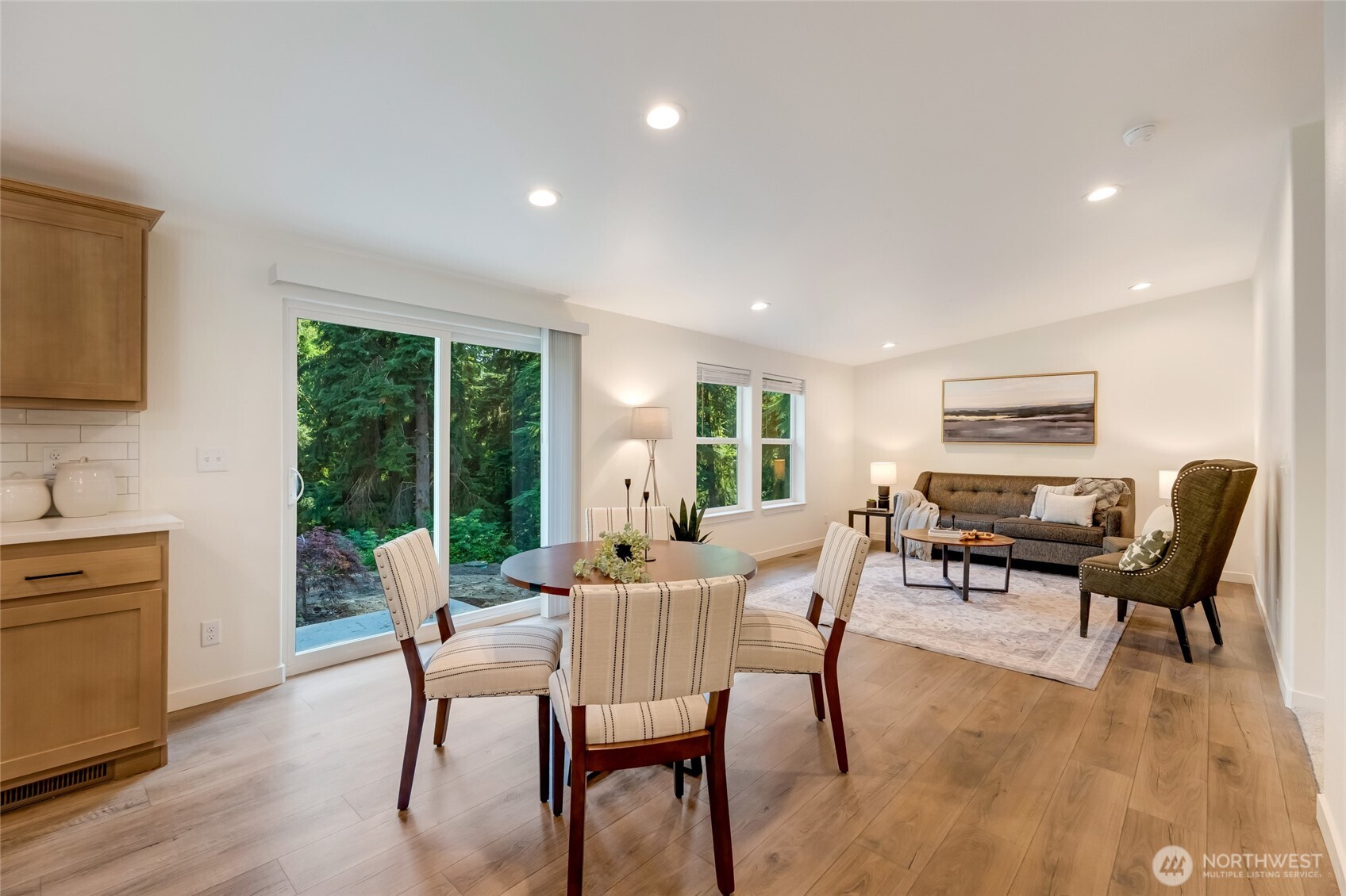 11426 Chain Lake Road Snohomish, WA 98290 - Photo 11 of 36 a dining room with furniture window and wooden floor