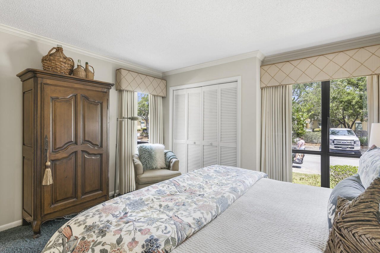 906 Harbour Point Lane, Unit 906 Miramar Beach, FL 32550 - Photo 18 of 36 a bedroom with a bed and large window