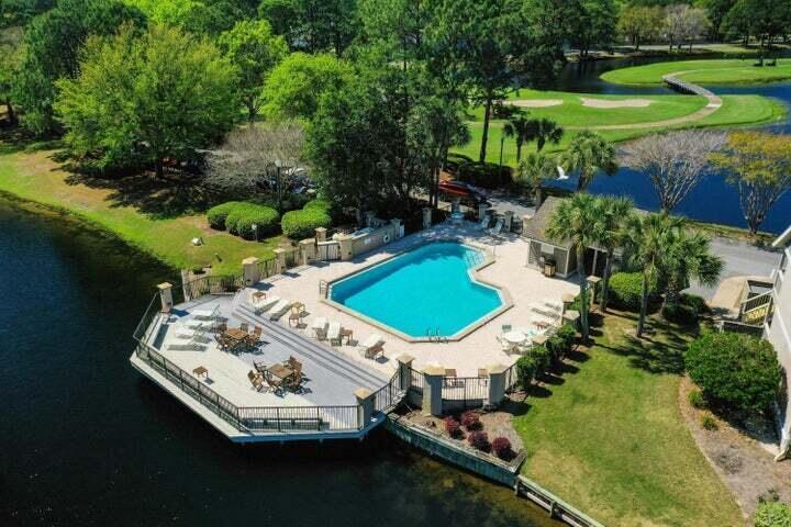906 Harbour Point Lane, Unit 906 Miramar Beach, FL 32550 - Photo 21 of 36 a swimming pool with outdoor seating and yard