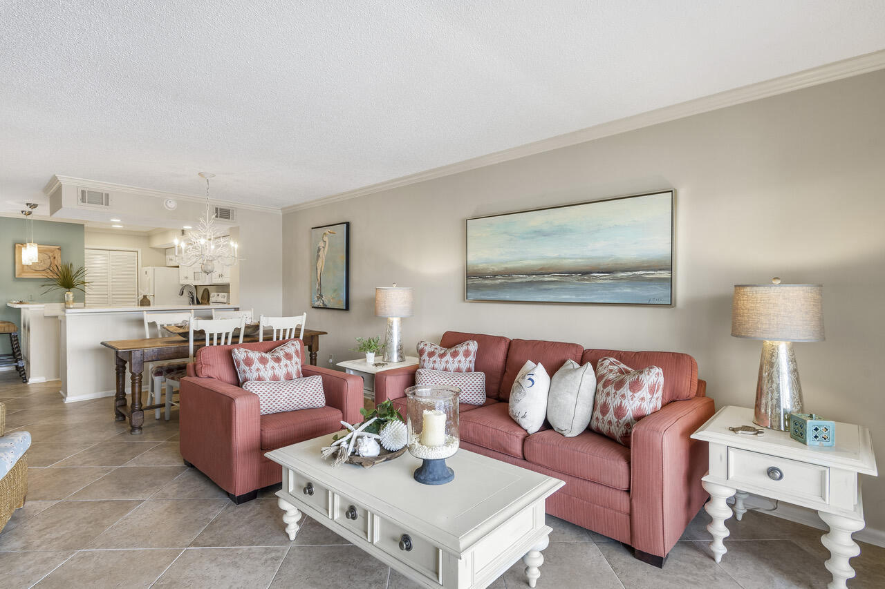 906 Harbour Point Lane, Unit 906 Miramar Beach, FL 32550 - Photo 8 of 36 a living room with furniture and a lamp