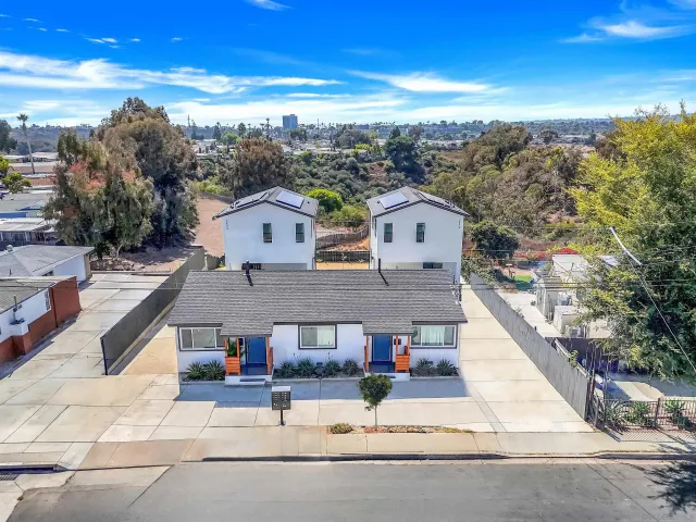 a aerial view of a house with a yard