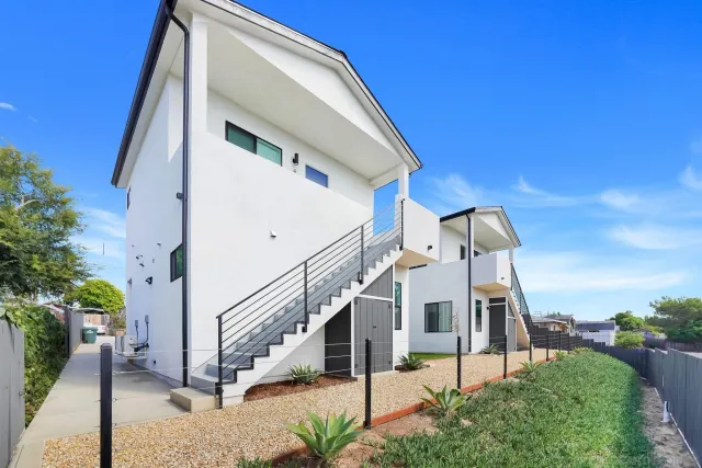 a view of a house with a small yard