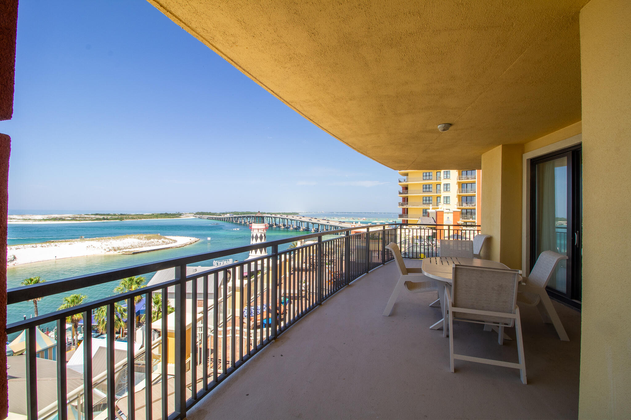 10 Harbor Boulevard, Unit E205H Destin, FL 32541 - Photo 12 of 30 a view of a chairs and table in the balcony