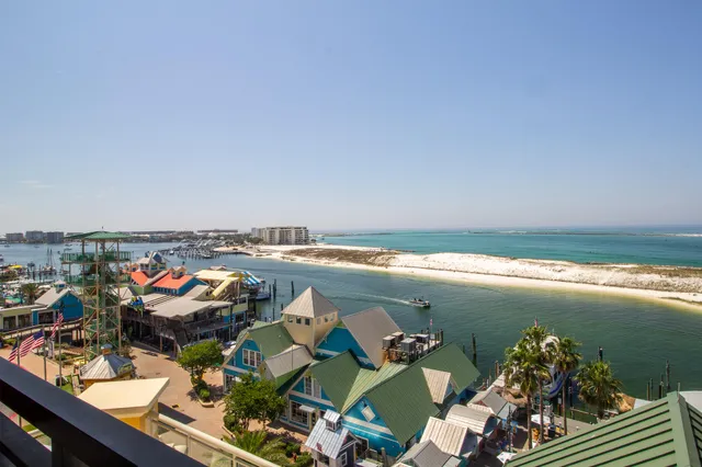 an aerial view of a house with a ocean view