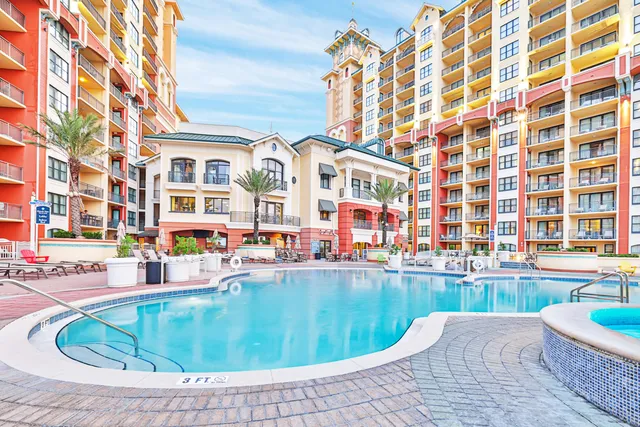 a view of a swimming pool with a patio
