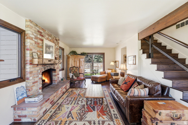 2635 Little Kate Road, Unit 21 Park City, UT 84060 - Photo 6 of 39 Living room with a brick fireplace and wood finished floors