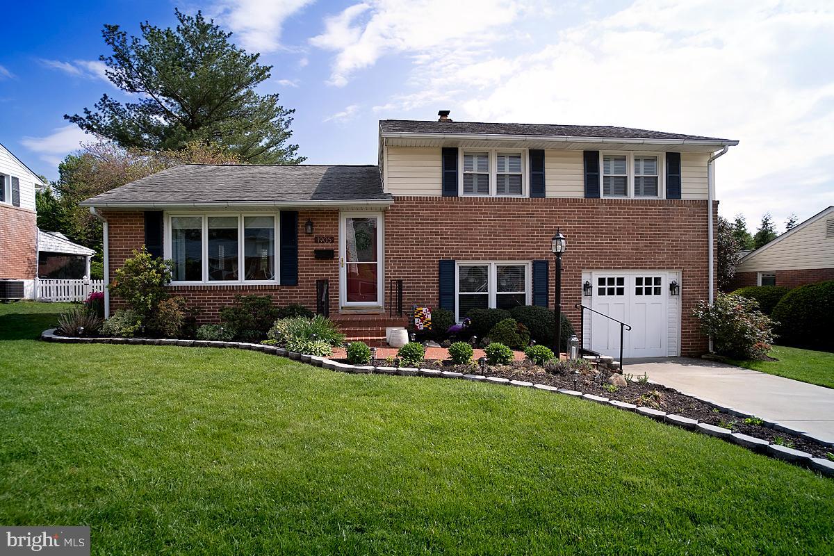 Mature landscaping and lush lawn