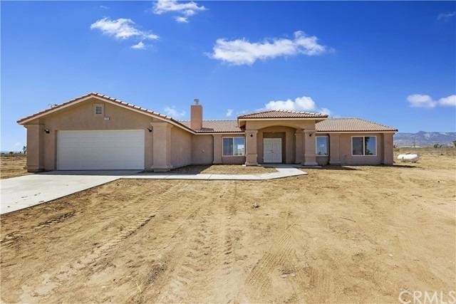 375 Solano Road Pinon Hills, CA 92372 - Photo 1 of 1 a front view of a house with a yard
