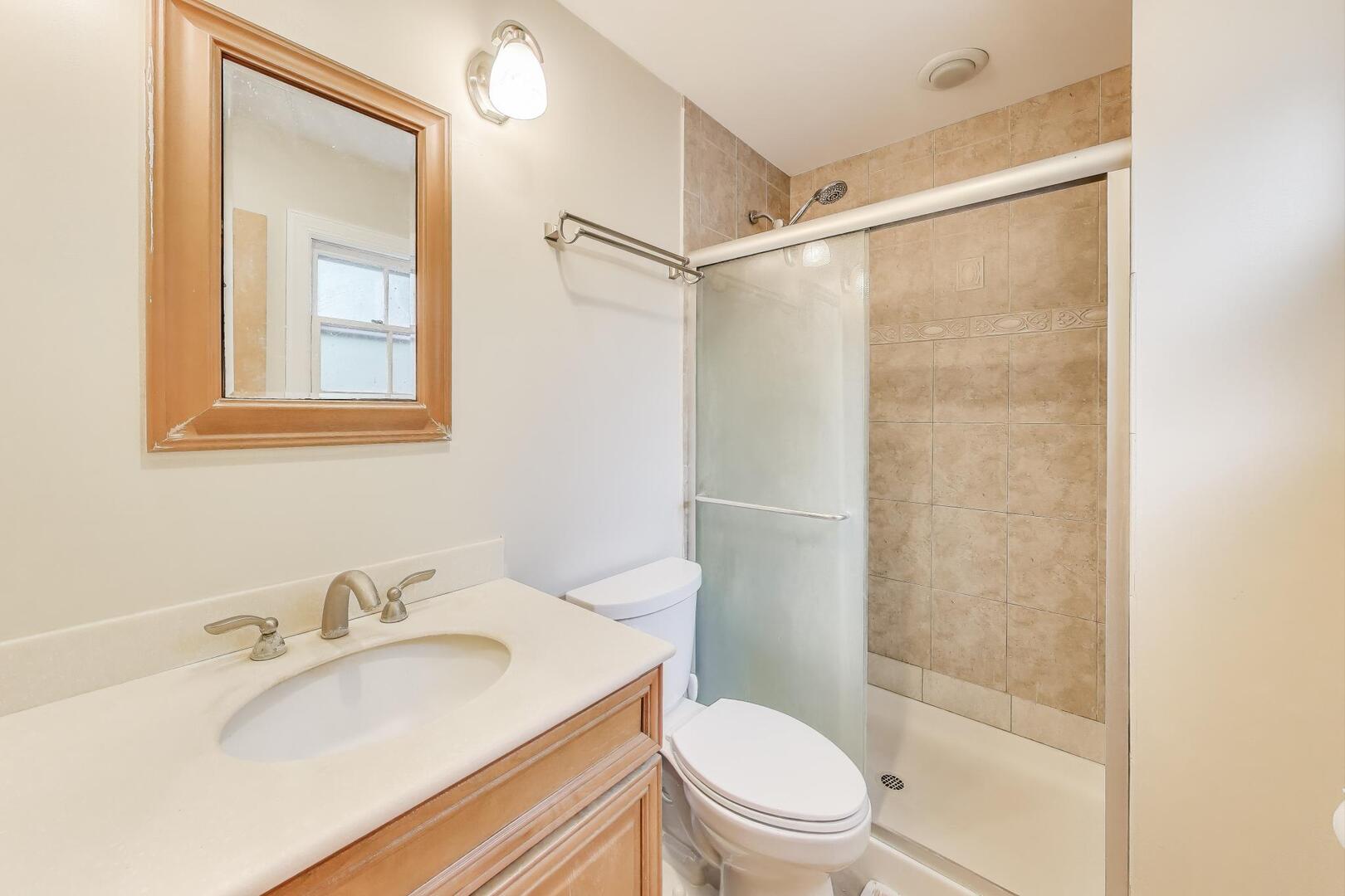 248 Beverly Road Barrington, IL 60010 - Photo 15 of 27 a bathroom with a sink toilet and shower