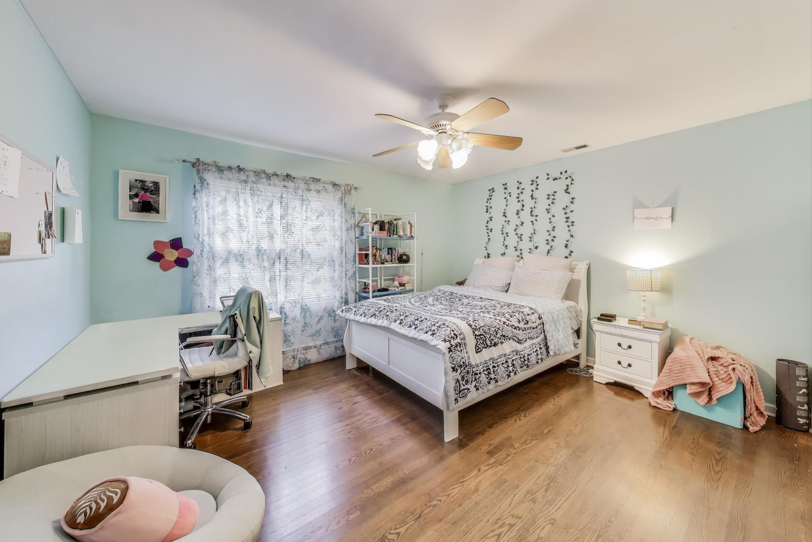 248 Beverly Road Barrington, IL 60010 - Photo 16 of 27 a bedroom with a bed and a chandelier