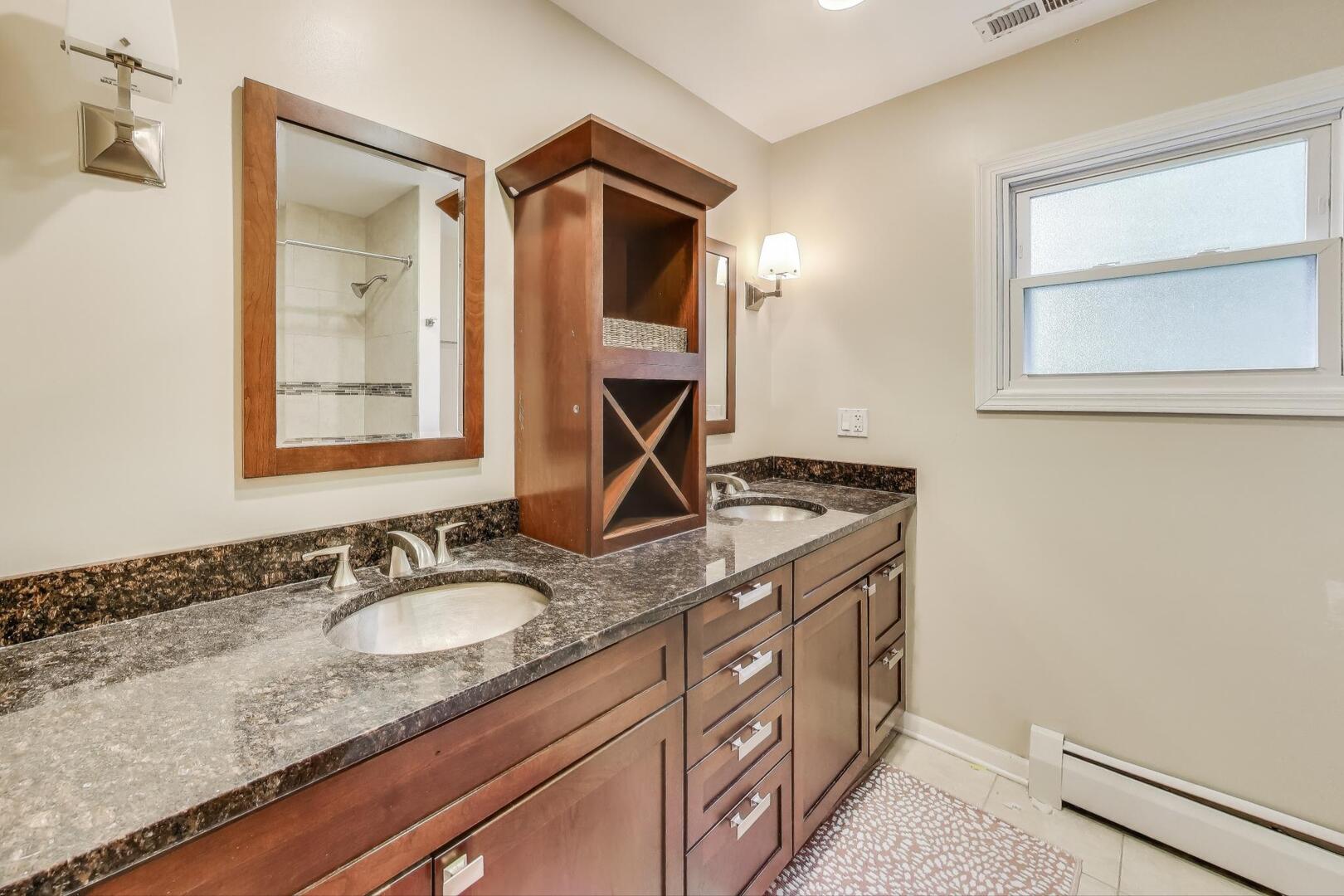 248 Beverly Road Barrington, IL 60010 - Photo 17 of 27 a en suite bathroom with a granite countertop sink and a mirror