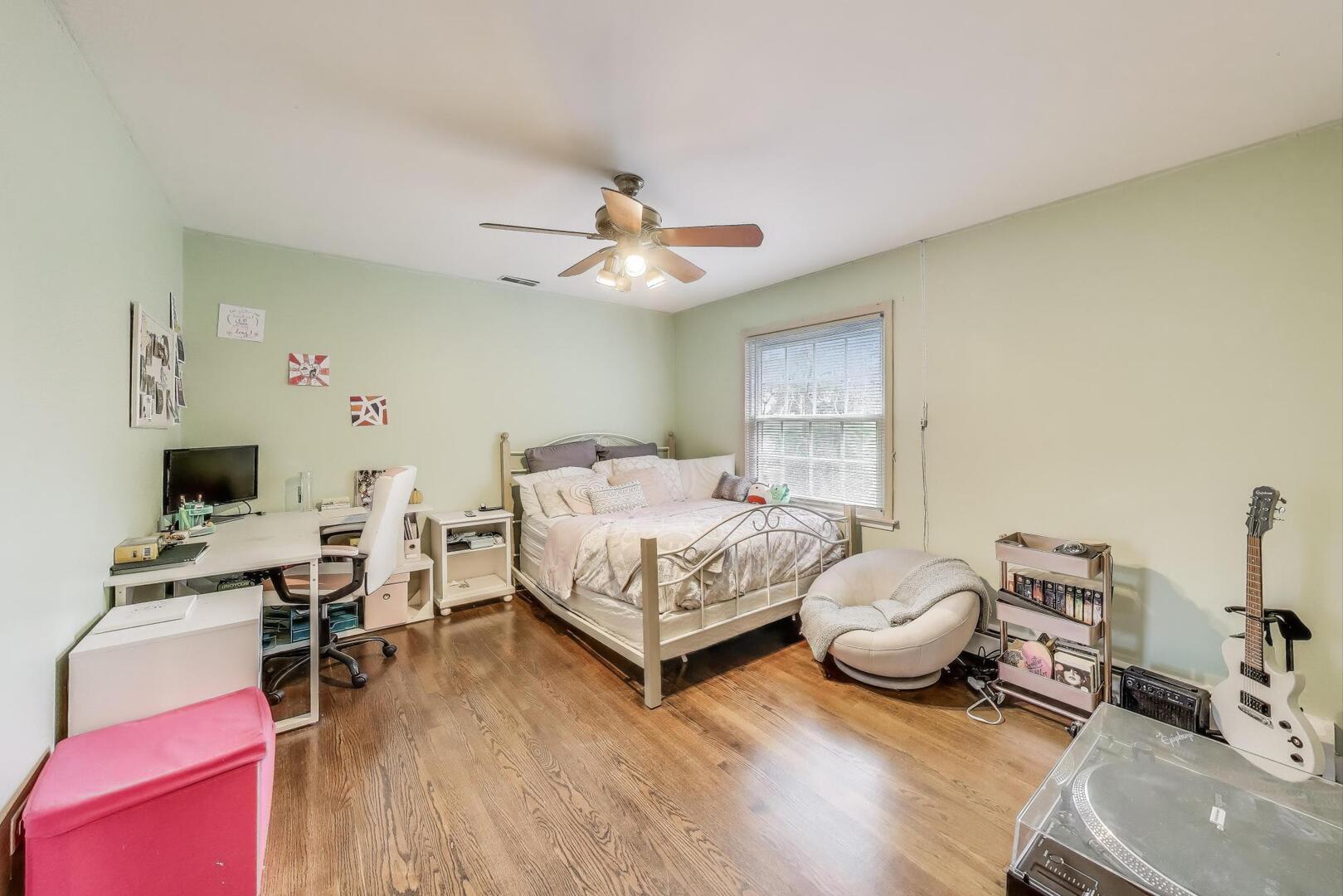 248 Beverly Road Barrington, IL 60010 - Photo 18 of 27 a bedroom with furniture and a wooden floor
