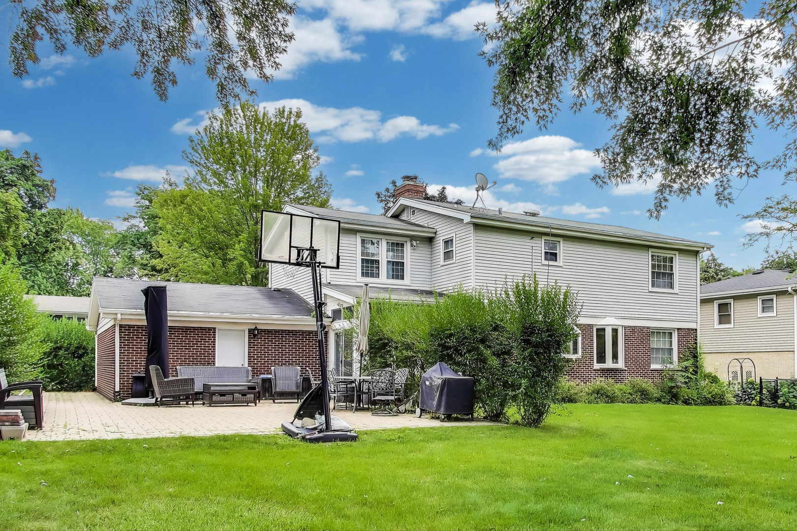 248 Beverly Road Barrington, IL 60010 - Photo 23 of 27 a view of a house with a yard and sitting area