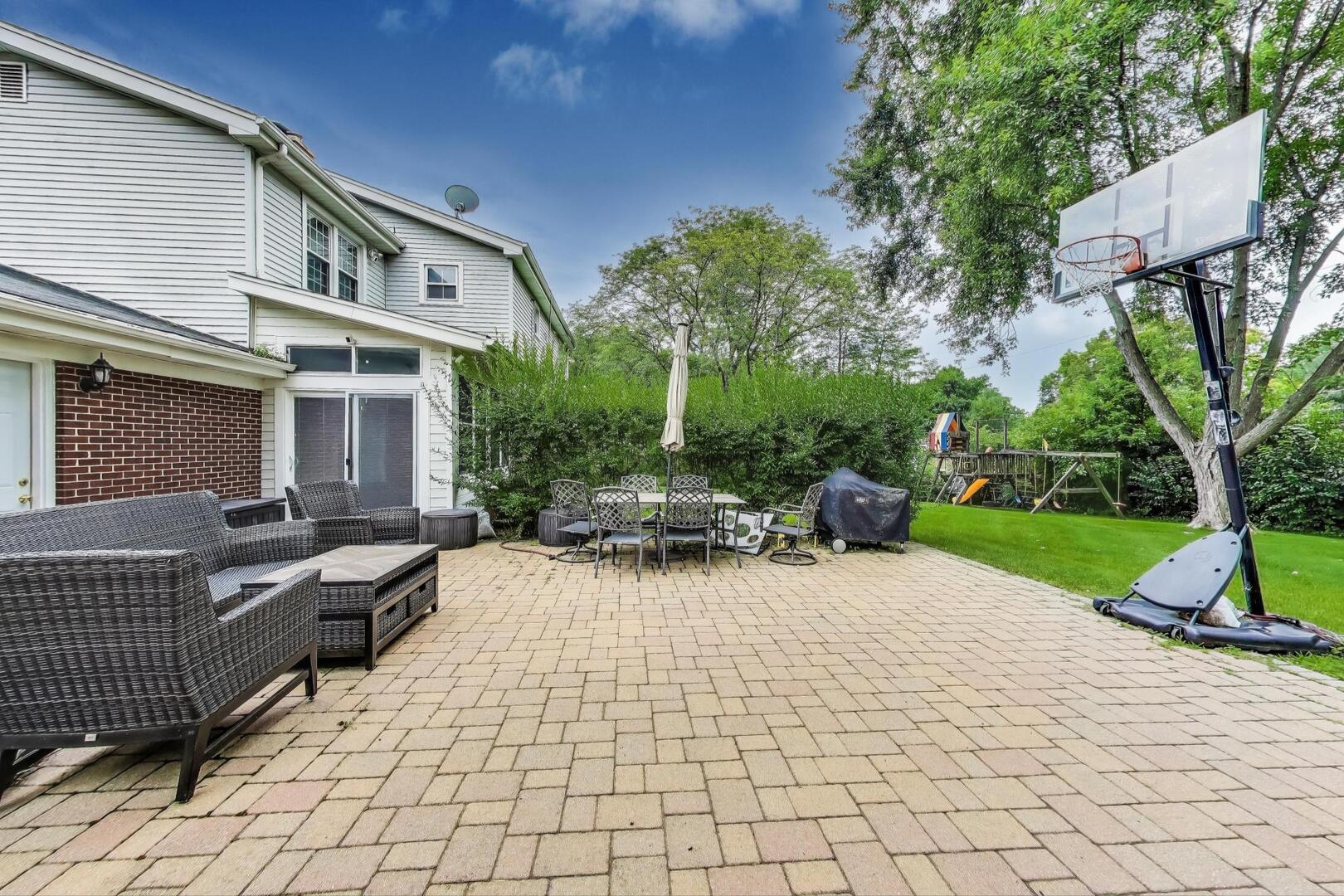 248 Beverly Road Barrington, IL 60010 - Photo 25 of 27 a view of a house with backyard and sitting area