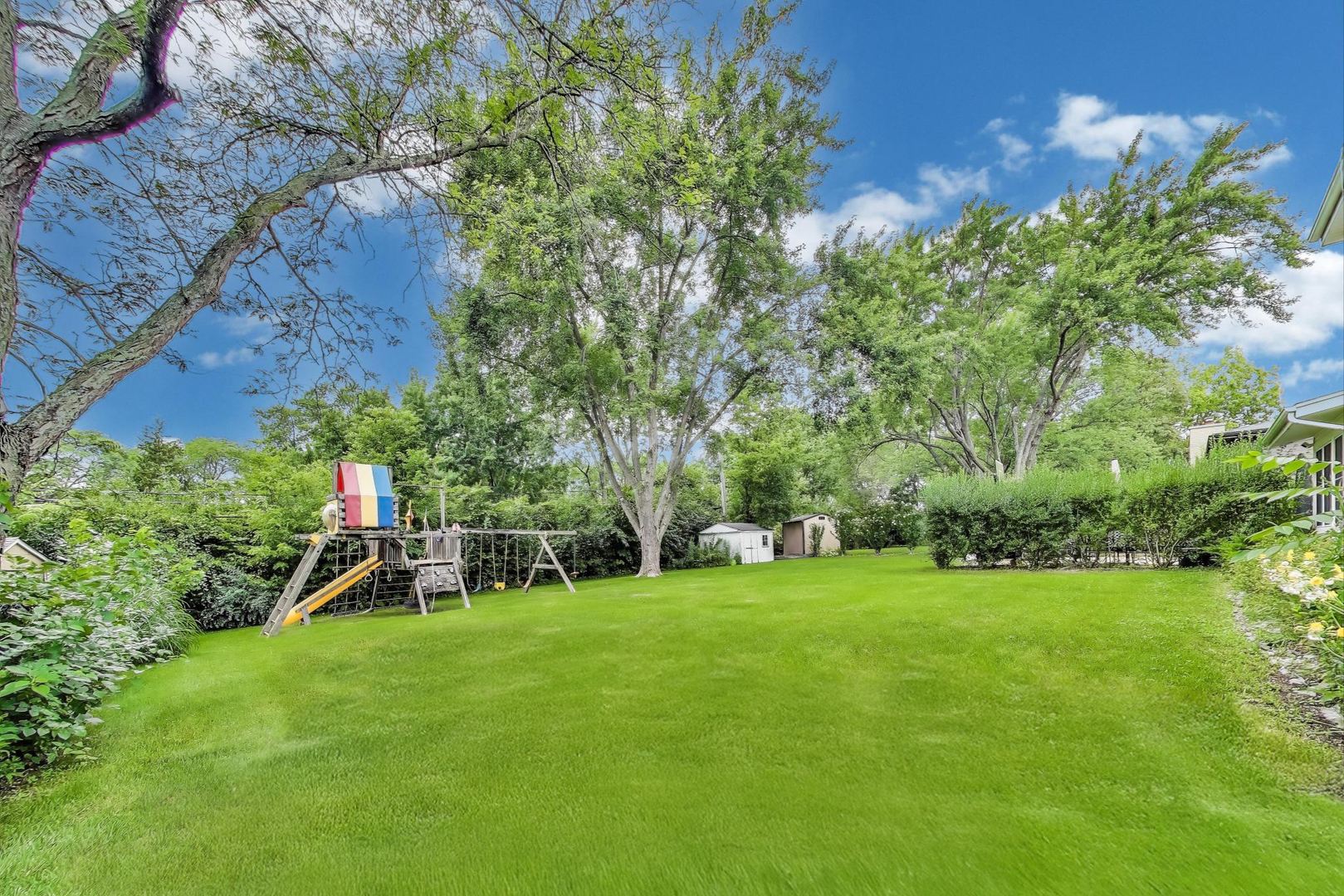 248 Beverly Road Barrington, IL 60010 - Photo 26 of 27 a view of a park with plants and a bench