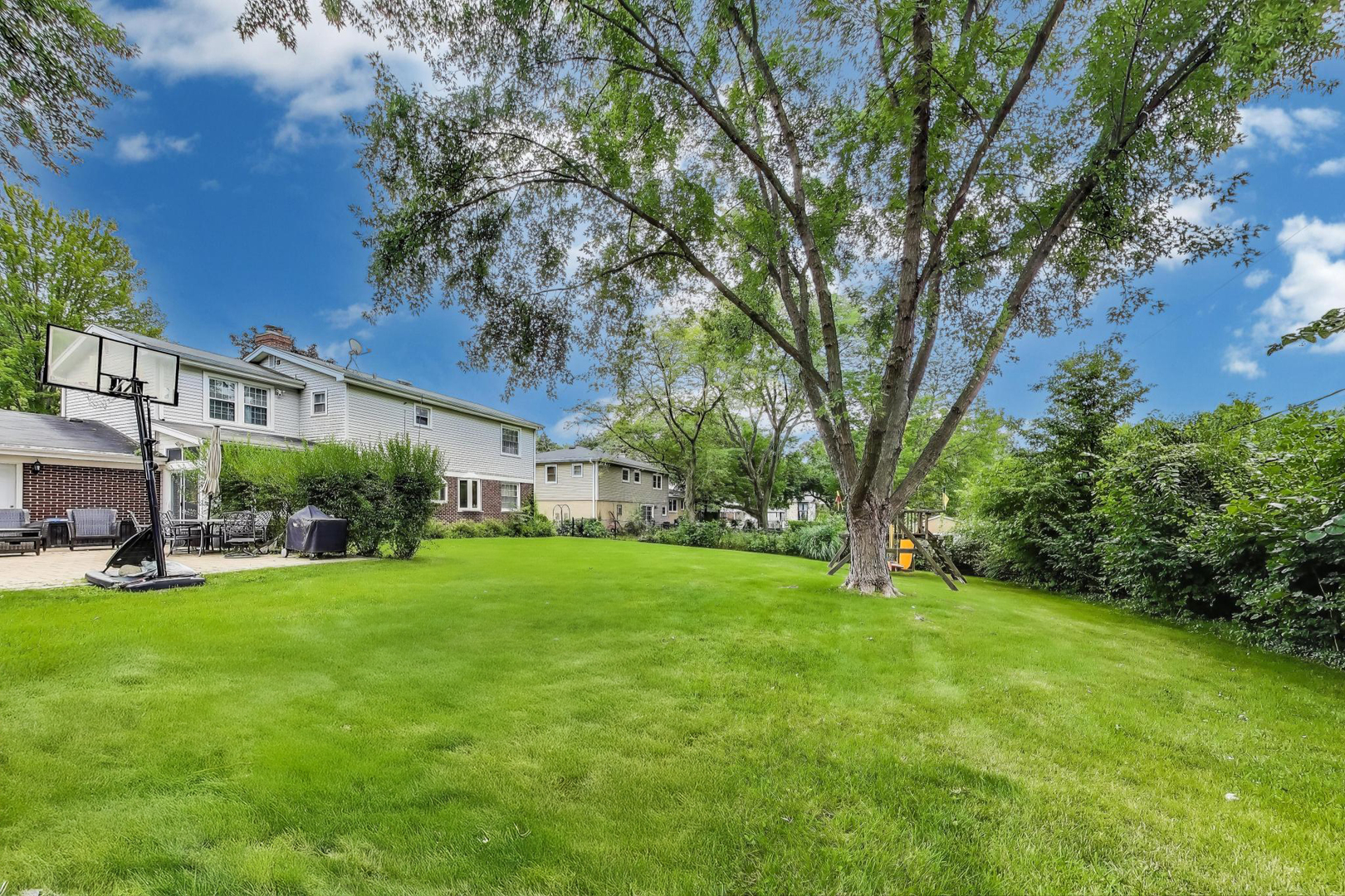 248 Beverly Road Barrington, IL 60010 - Photo 27 of 27 a view of a house with a big yard and large trees