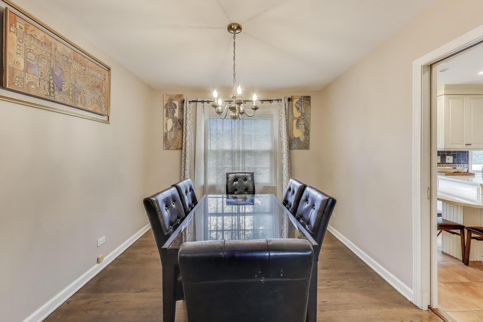 248 Beverly Road Barrington, IL 60010 - Photo 4 of 27 a view of a dining room with furniture wooden floor and chandelier