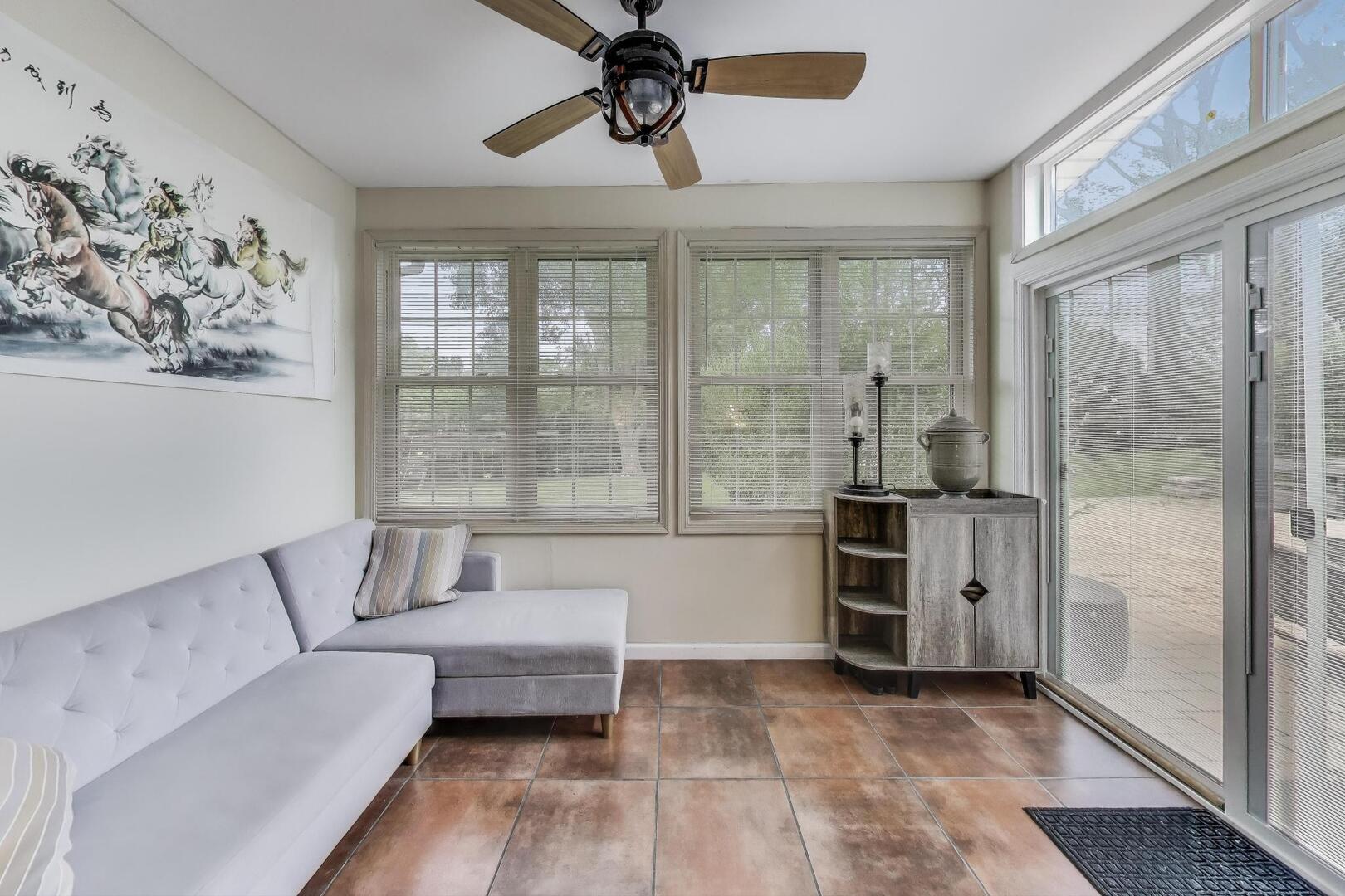 248 Beverly Road Barrington, IL 60010 - Photo 10 of 27 a living room with furniture and a floor to ceiling window