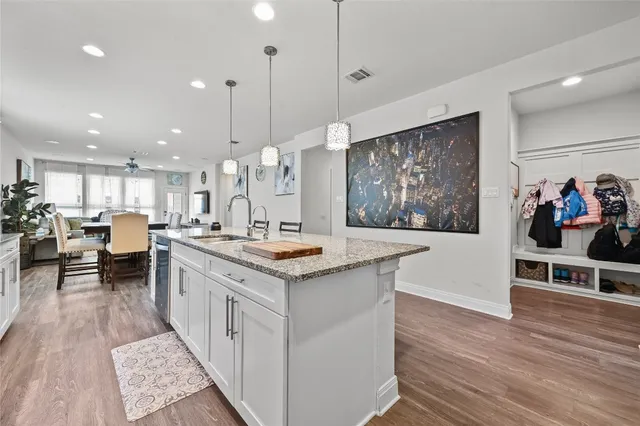 a kitchen with kitchen island granite countertop a sink and counter top space