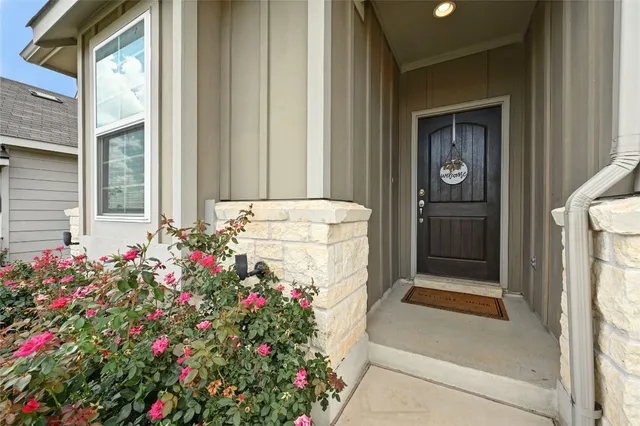 a flower plants in front of a door