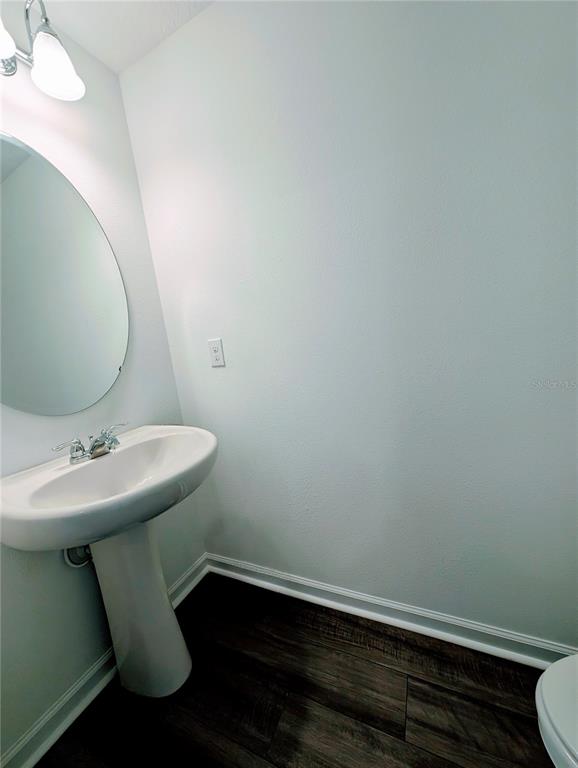 6215 Daerr Rdg Street Zephyrhills, FL 33542 - Photo 15 of 27 a bathroom with a sink a toilet