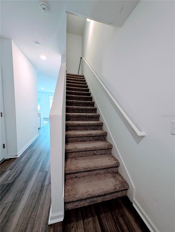 6215 Daerr Rdg Street Zephyrhills, FL 33542 - Photo 17 of 27 a view of entryway and hall with wooden floor