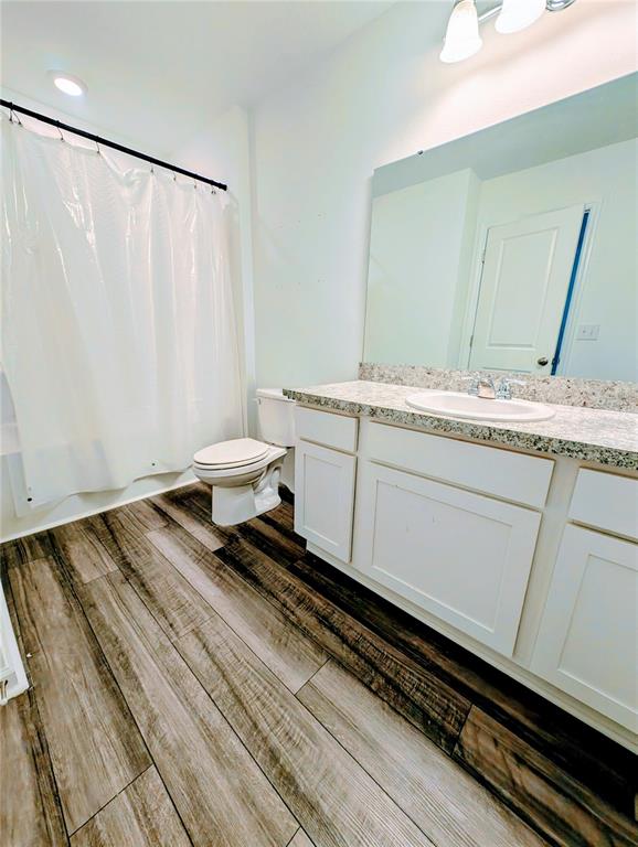 6215 Daerr Rdg Street Zephyrhills, FL 33542 - Photo 21 of 27 a bathroom with a granite countertop sink and a mirror