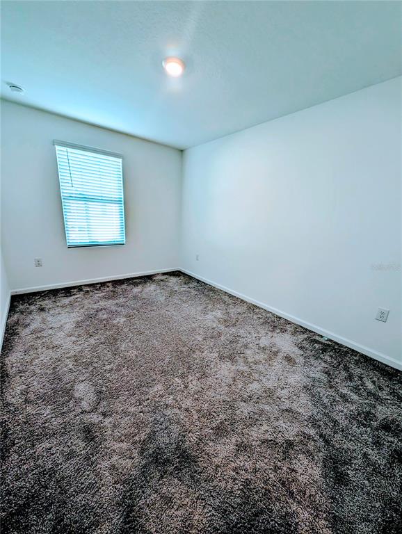 6215 Daerr Rdg Street Zephyrhills, FL 33542 - Photo 24 of 27 an empty room with a window
