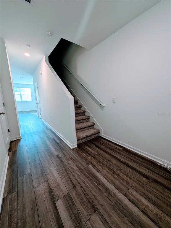 6215 Daerr Rdg Street Zephyrhills, FL 33542 - Photo 9 of 27 wooden floor in an empty room