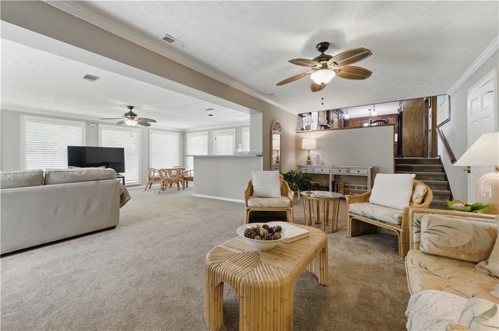 4205 Jeri Lynn Court Tucker, GA 30084 - Photo 13 of 34 a living room with furniture and a chandelier