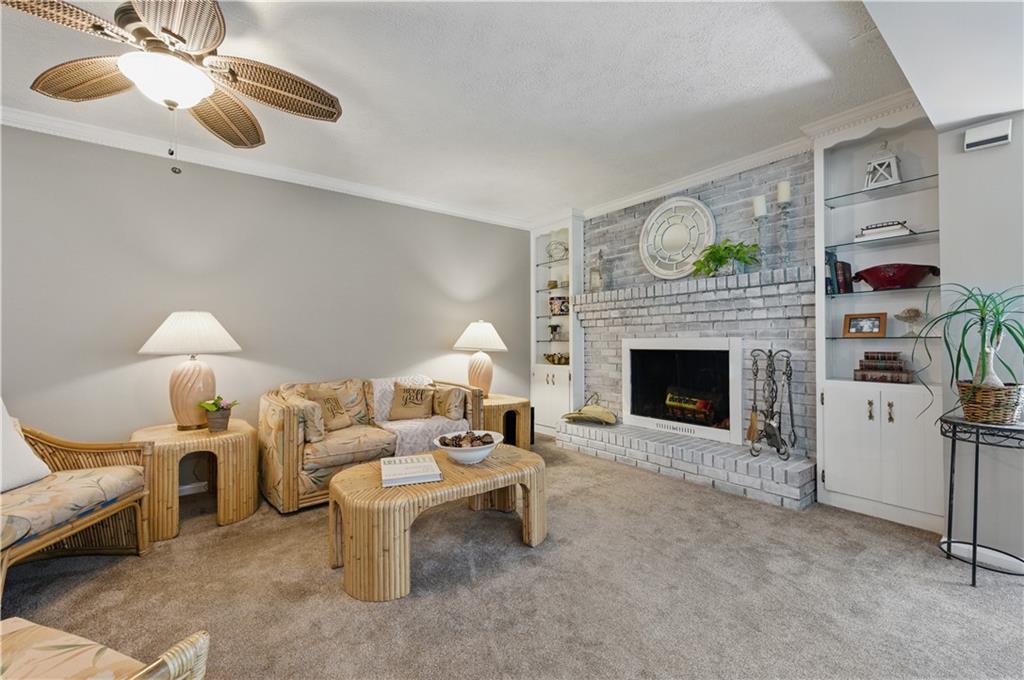 4205 Jeri Lynn Court Tucker, GA 30084 - Photo 15 of 34 a living room with furniture and a fireplace