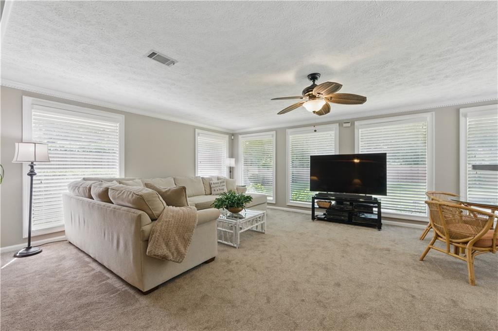 4205 Jeri Lynn Court Tucker, GA 30084 - Photo 16 of 34 a living room with furniture and a flat screen tv