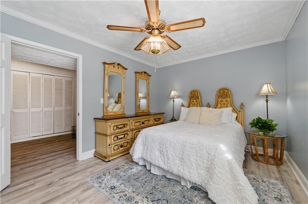 4205 Jeri Lynn Court Tucker, GA 30084 - Photo 18 of 34 a bedroom with a bed and wooden floor