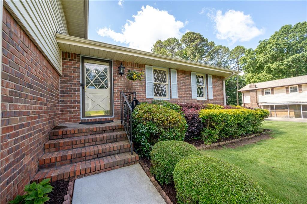 4205 Jeri Lynn Court Tucker, GA 30084 - Photo 2 of 34 a front view of a house with garden