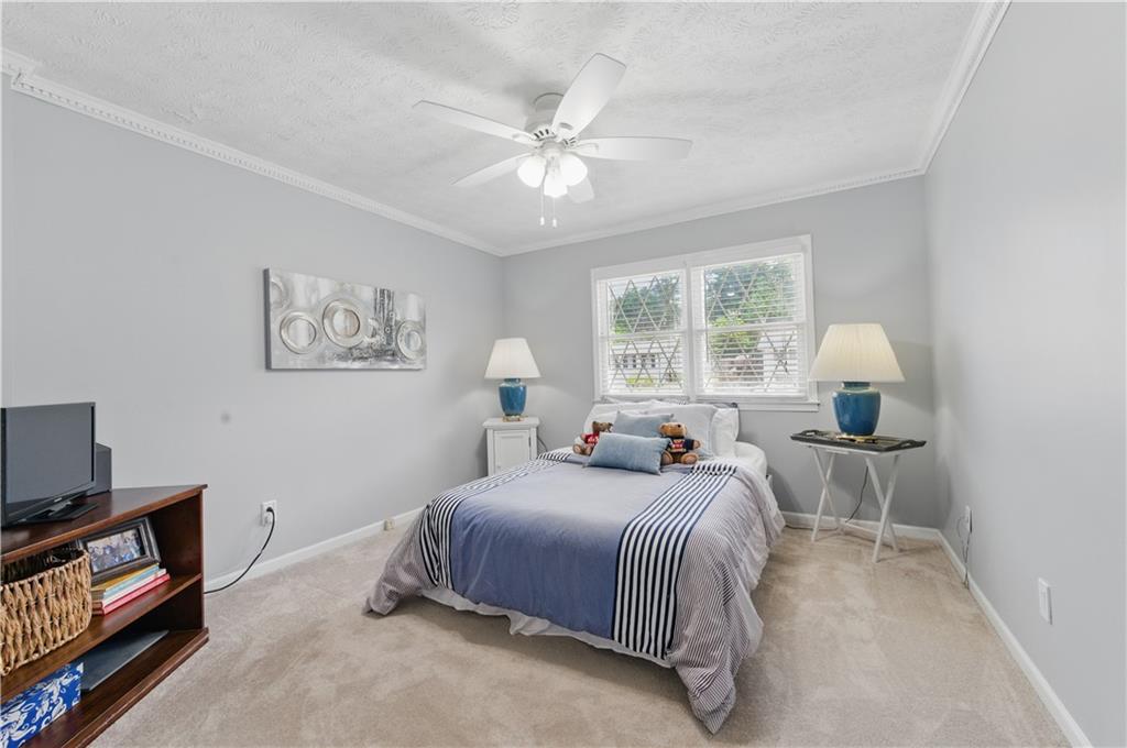 4205 Jeri Lynn Court Tucker, GA 30084 - Photo 22 of 34 a bedroom with a bed and window
