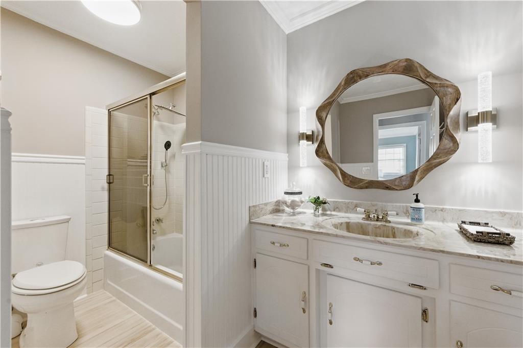 4205 Jeri Lynn Court Tucker, GA 30084 - Photo 28 of 34 a bathroom with a toilet sink vanity granite and shower